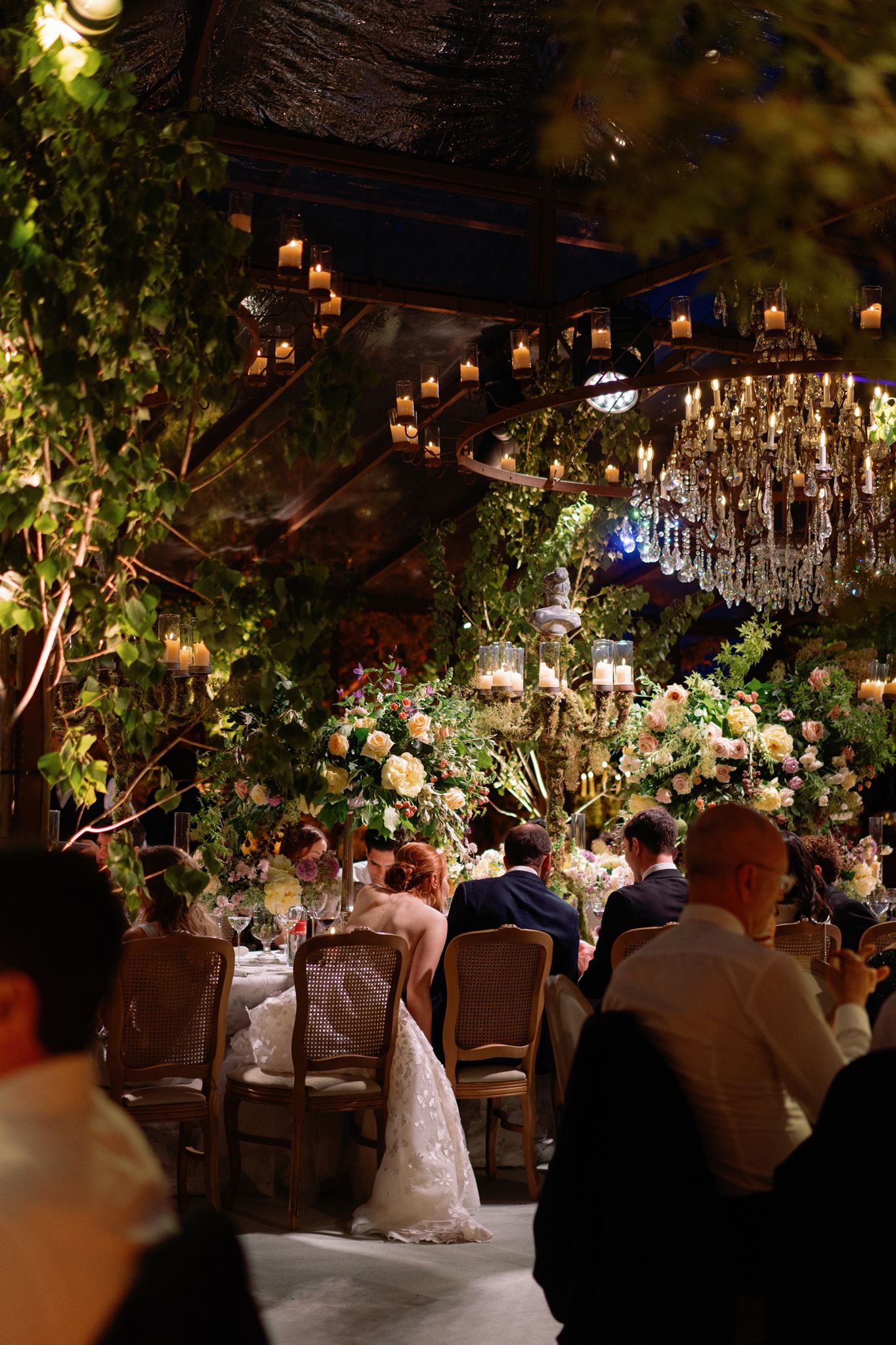 Wedding reception with florals and handmade paper menus.